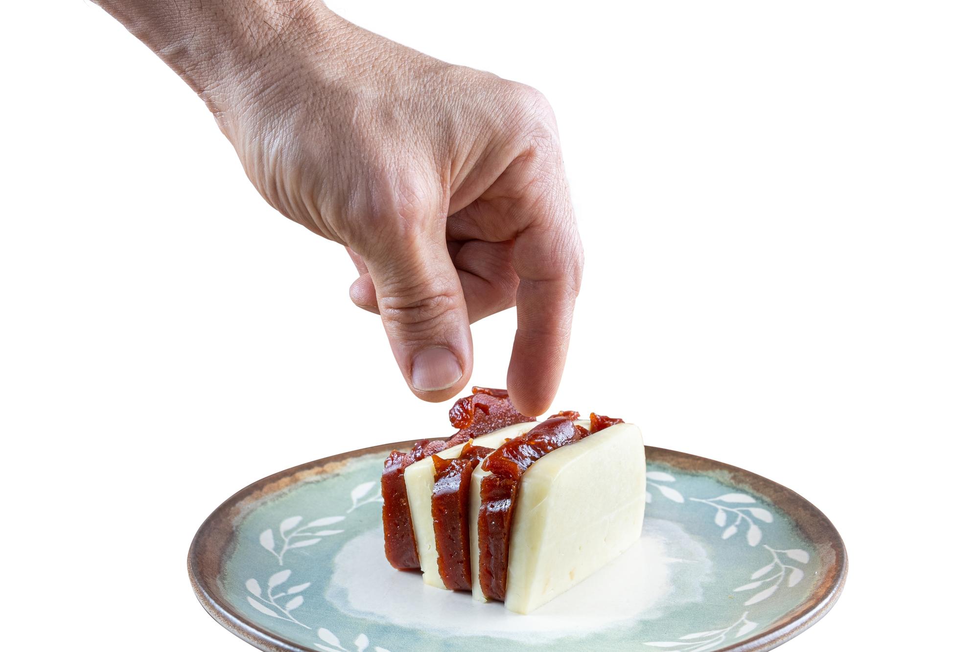 Hands plating a dessert