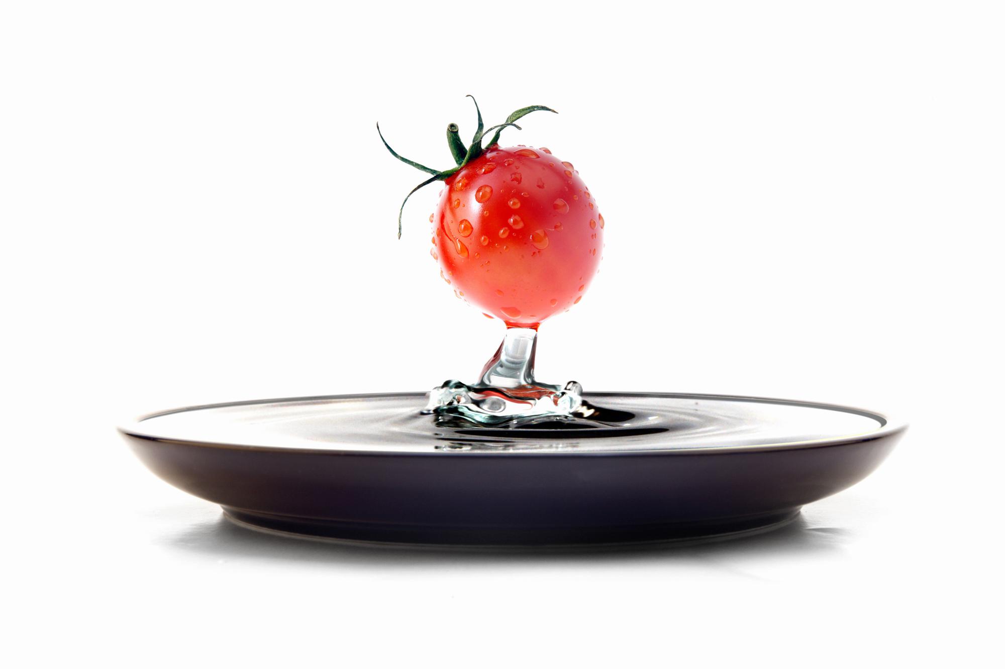 Chef designing a modern dish in studio